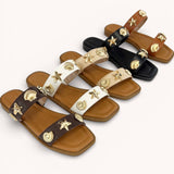 SEASHELL EMBELLISHED DOUBLE STRAP FLAT SAND: NATURAL RAFFIA STRAW