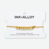Goldie  - Gold Lurex String Bracelet w/ Block Letters  - Strength