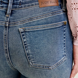 Mid Rise Flare Leg Medium Blue Jeans With Flap Pockets by Judy Blue